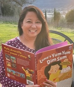 Natasha Yim holding her book