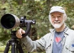 Don Jackson, wildlife photographer, in the field with his camera. 