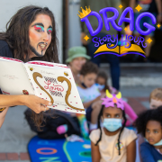 Photo of Drag King Vera reading Worm Loves Worm.