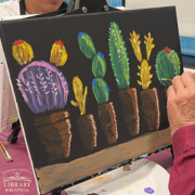 Photo of a painting of succulents plants and cacti. 