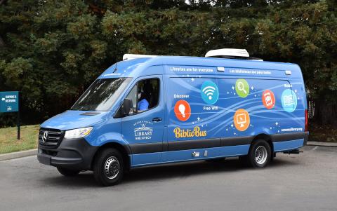 Blue van serves as a mobile library branch.