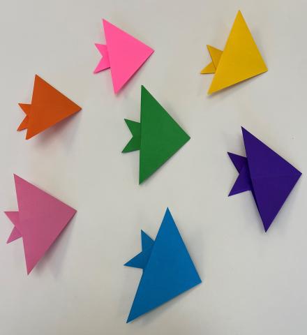 Photo of paper folding fish in different colors