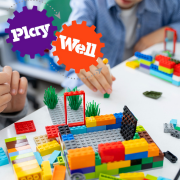 PlayWell logo plus hands playing with LEGO.