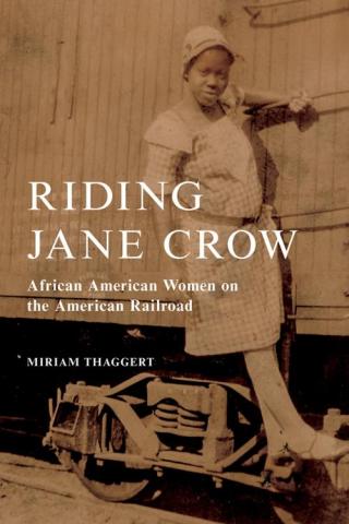 Book cover showing African American woman holding onto a rail car