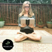 Photo of yoga instructor sitting in lotus position.