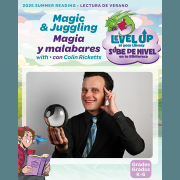 Photo of magician Colin Rickets in a black shirt and tie.