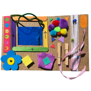 Photo of a homemade sensory board featuring different types of materials and textures.