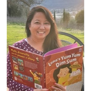 Natasha Yim holding her book